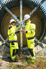 Wind Turbine Engineer Inspecting Equipment at Renewable Energy Site