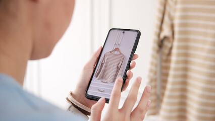Young adult woman asia people take photo used shirt second hand sell. Go green happy home eco care reduce zero waste fabric issue donate buy sale online app side hustle reuse swap clothes store shop.
