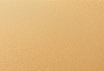 Fototapeta premium Close-up of textured cardboard, showing subtle fiber patterns and variations in shading, background, close-up
