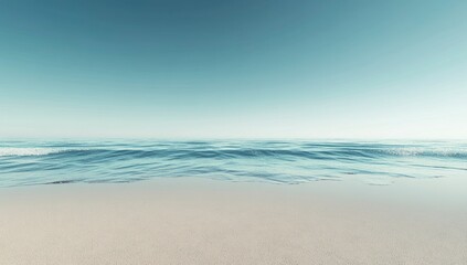 Obraz premium Serene Coastal Scene: Tranquil Ocean Meets Sandy Shore