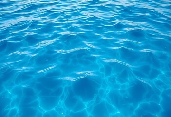 Obraz premium Deep, saturated blue water, textured surface with subtle light reflections, coral, reflective