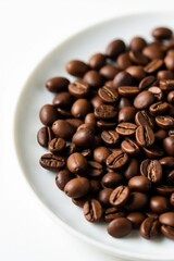 Fototapeta premium Roasted coffee beans scattered on a white plate , plate, element