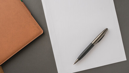 notebook, pen and blank notepad on the desk