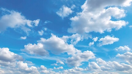 Fototapeta premium Clear Blue Sky with Fluffy White Clouds and a Peaceful Atmosphere