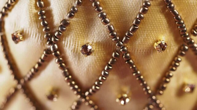 Intricate beadwork and stitching on elegant fabric