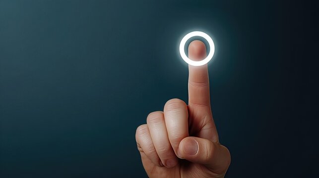 A hand presses the glowing start button, with the index finger activating the power symbol, sparking the beginning of a new business project or digital startup.
