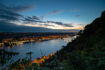 Budapest, Hungary - October 12, 2024: Night Panorama from Gellért Hill – The Danube sparkling with reflected city lights under a starry sky