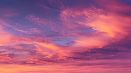Naklejka premium Vivid Sunset Sky Filled with Warm Pink, Orange, and Purple Hues