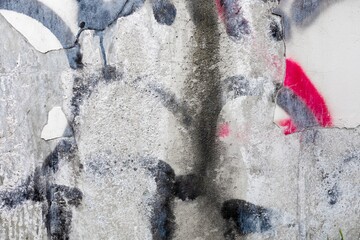 Bold 90s graffiti in black, grey, red on concrete wall. Urban grunge vibe, spray texture. Trendy...