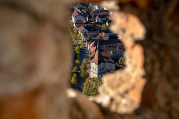 Bran, Romania - October 23, 2024: Framed Vista Through Rasnov Fortress Window