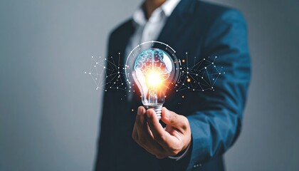 A businessman in a tailored suit confidently holds an illuminated electric light bulb, showcasing a detailed brain inside, symbolizing innovative ideas.