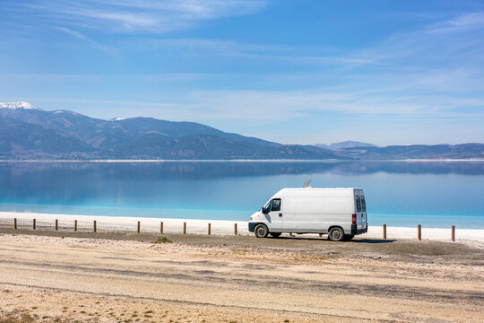 White camper van parked near Salda golu lake in Turkey
