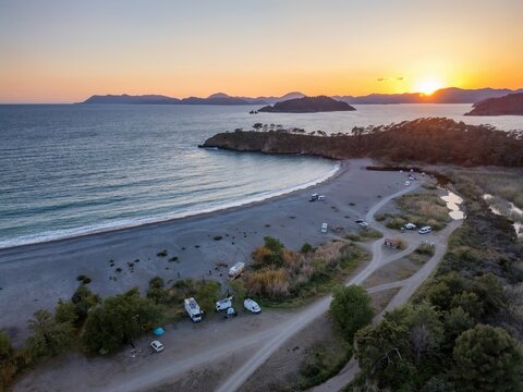 Aerial view of camper vans enjoying sunset at Karaot Beach