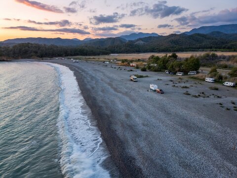 Aerial view of camper vans enjoying sunset at Karaot Beach