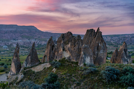 Cappadocia rock formations glowing during colorful sunset