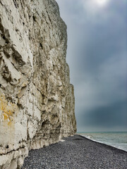 Seven Sisters, cliff coast in Sussex, England, on a cloudy day.