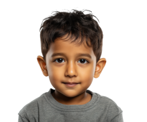 Child with a friendly smile wearing a gray shirt indoors