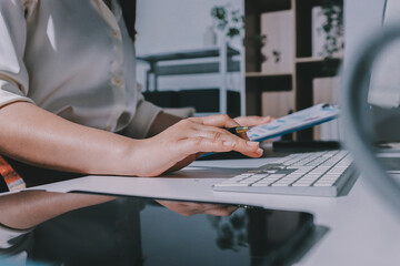 Expert woman asian female people review data number costing managerial account prepare monthly...