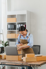 Woman Preparing Packages for Shipping at Home