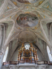 Baroque Pipe Organ Below Ornate Church Ceiling in Bressanone - Italy