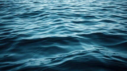 Fototapeta premium Deep ocean water surface displays rippling textures.