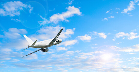 Airplane flying, picturesque travel background with white airplane in the sky