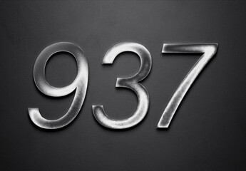 Chrome metal 3D number design of 937 on grey background.