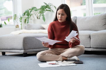 Financial crisis or debt concept, Young Asian woman feeling worry and stress after received many...
