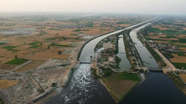 Sutlej River channels and reservoirs surrounded by agricultural fields between India and Pakistan