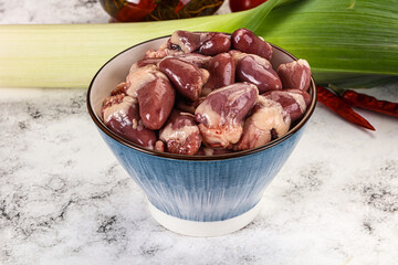 Raw chicken hearts in the bowl