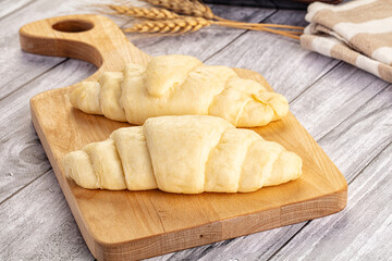Raw uncooked croissant for bake