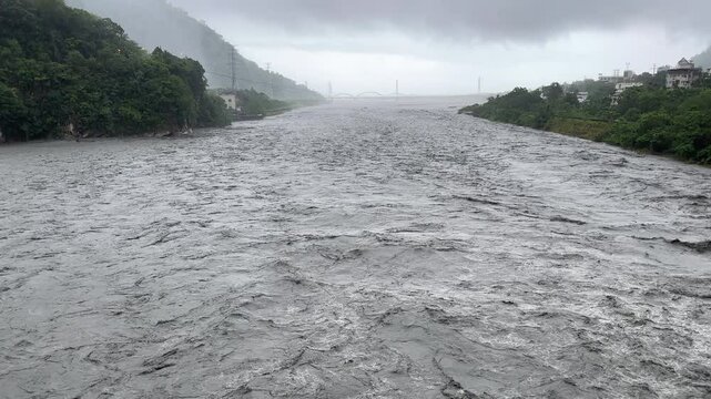 Fast Flowing River Flood Waters After Tropical Storm Heavy Rain - Haikui