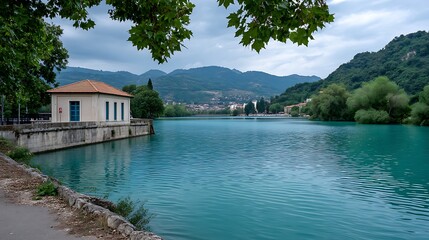 Serene River House with Mountain Vista, and Teal Water.