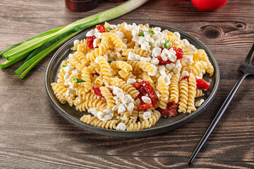 Italian pasta fusili with curd