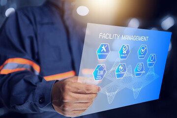 Facility management concept with technicain using virtual screen to manage and monitoring infrastructure to achieve maximum efficiency and save maintenance cost and be environmentally friendly