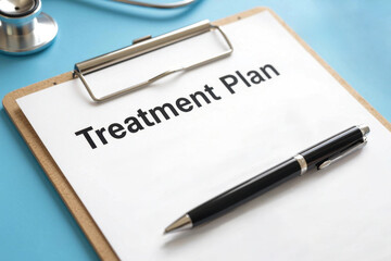 Close-up shot of a medical clipboard with a patient treatment plan in a modern clinic, emphasizing healthcare access and outcome improvement.