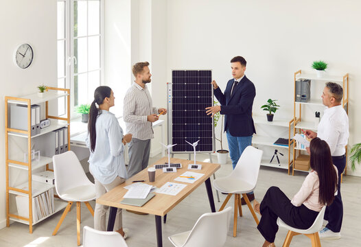 Team of business startup cooperation partners consult with energy science research expert who explains investment strategy at expertise discussion education workshop on modern solar panel installation