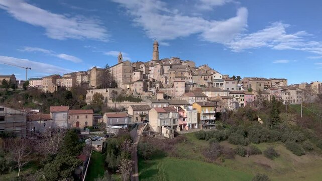 Stunning aerial footage of Petritoli, Le Marche, Italy. Captured on a sunny afternoon, featuring the medieval skyline and surrounding countryside from above.