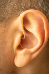 Hearing aid ear of man