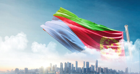 Eritrea national flag waving in the sky with cityscape. Eritrea national flag for independence day.