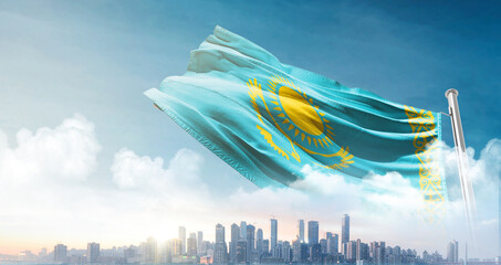 Kazakhstan national flag waving in the sky with cityscape. Kazakhstan national flag for...