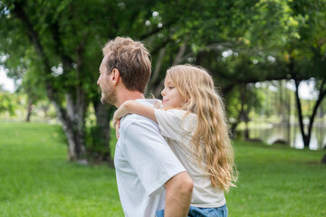 Fototapeta premium Happy family parent children having picnic outdoor activity. Enjoy happiness moment summer playing together including father mother son and daughter relaxing in the morning sunrise.