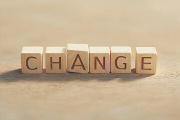 Wooden blocks spelling the word CHANGE depicting transformation concept