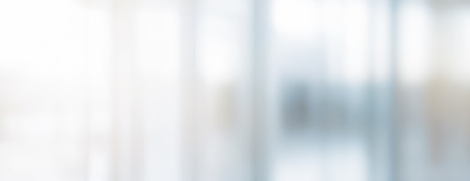 Abstract blurred background with white gray and blue tones soft light effect.