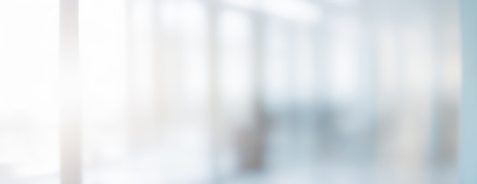 Abstract blurred background with light and neutral tones.