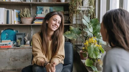 A school counselor interacting with a student in a cozy office space filled with books and plants creating an inviting atmosphere for emotional support and guidance.