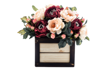 Elegant floral arrangement in a wooden box.  A beautiful bouquet of artificial flowers in various shades of pink and burgundy, displayed in a small wooden crate