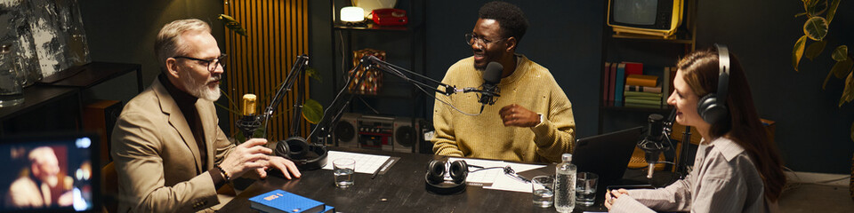 Header with people discussing new book during podcast