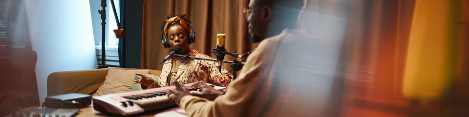 Header with woman singing in recording studio