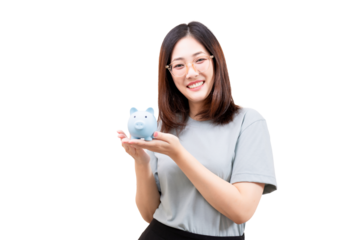 Asian young woman smiling and holding a blue piggy bank in her hands.